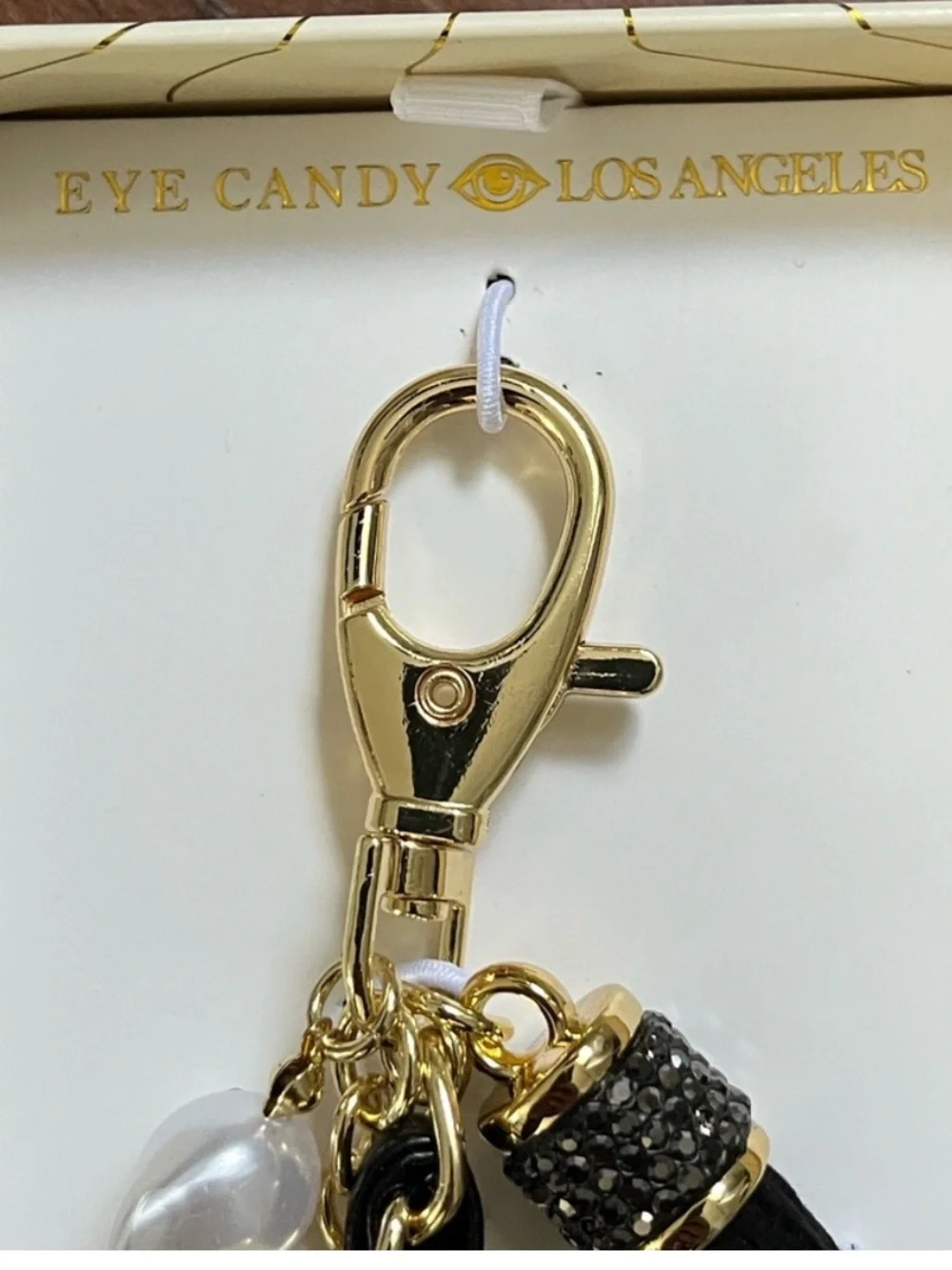 Eye Candy Black rhinestone bag charm key chain with faux pearls and gold chain